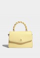 TWISTED TOP HANDLE BAG IN SUNSHINE YELLOW